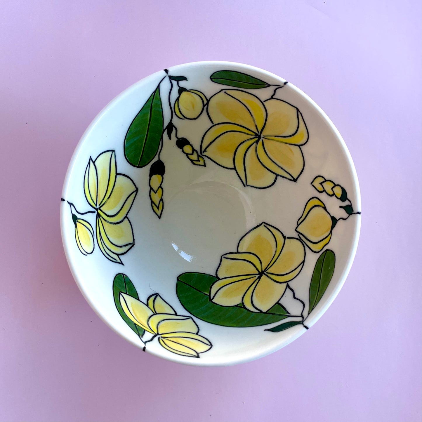 Small porcelain bowl with yellow frangipani (plumeria) design