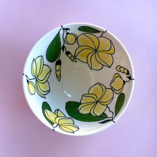 Small porcelain bowl with yellow frangipani (plumeria) design