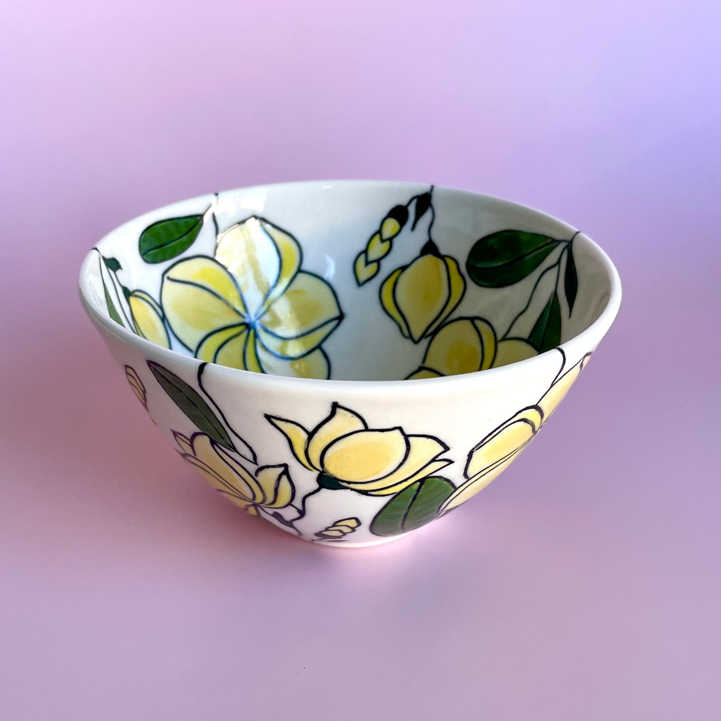 Small porcelain bowl with yellow frangipani (plumeria) design