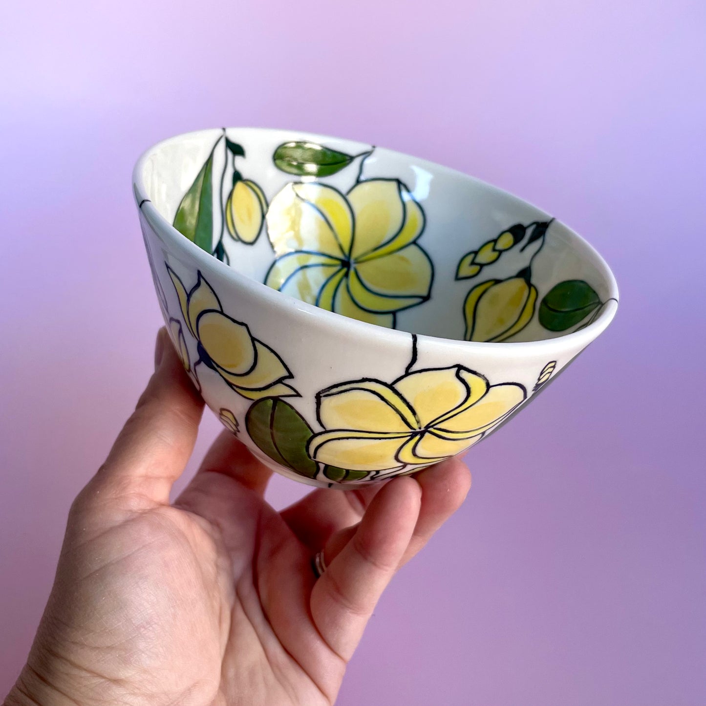 Small porcelain bowl with yellow frangipani (plumeria) design
