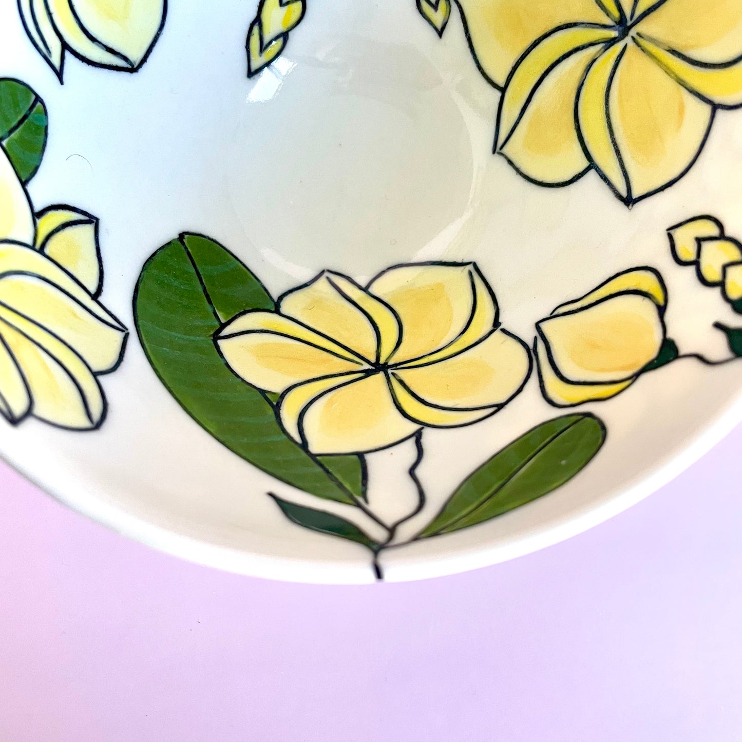 Small porcelain bowl with yellow frangipani (plumeria) design