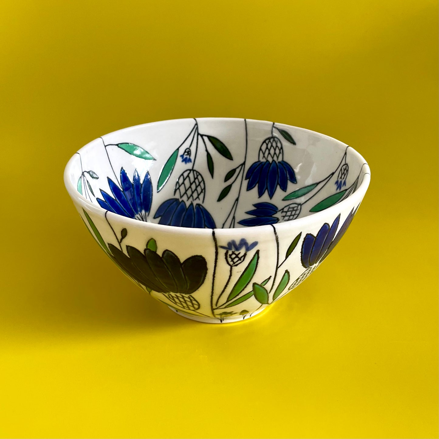 Medium porcelain bowl with blue coneflowers